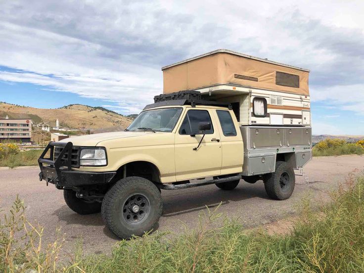 a truck with a camper attached to the back