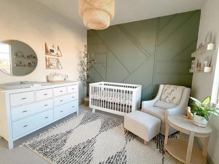 a baby's room with a crib, dresser and chair