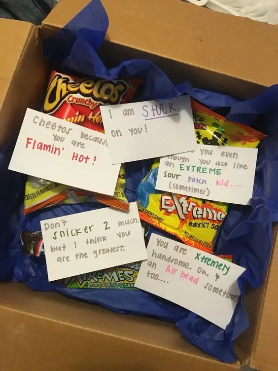 a box filled with lots of candy sitting on top of a table