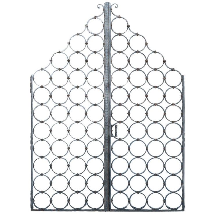 an iron gate with circles on the top and bottom, is shown in front of a white background