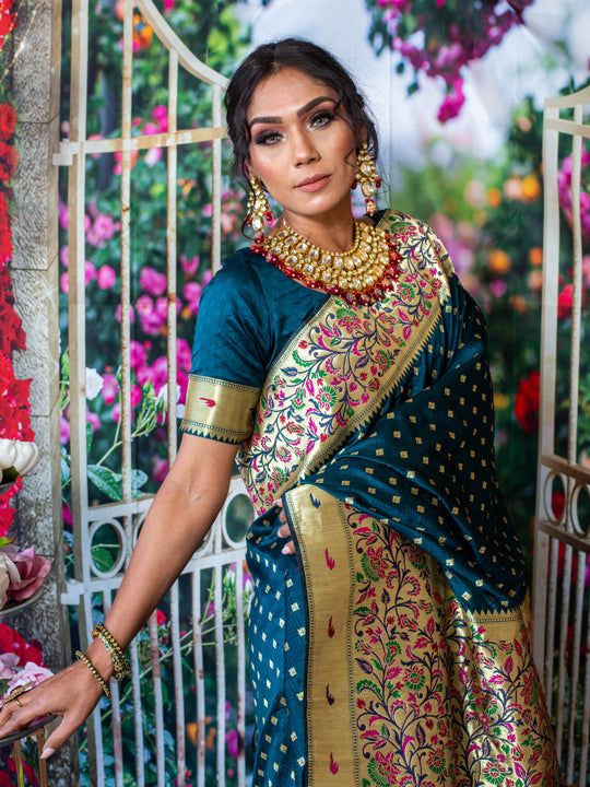 You will be the center of attention in this breathtaking paithani silk saree which comes with intricate reshim and gold weaving. Saree has beautiful tree and leaf designs This beautiful paithani has stitched blouse. Size - 34-42 Color - Royal Blue Fabric & Work Style - - Paithani Silk Saree - Embellishments at the border of saree with tree and leaf designs. Details - - Assured quality. - Wash care instruction: Dry clean only. - Slight variation in color is possible due to digital photography. Festival Paithani Silk Pre-draped Saree With Zari Work, Bollywood Style Paithani Silk Pre-draped Saree For Puja, Paithani Silk Pre-draped Saree For Traditional Ceremonies, Festival Paithani Silk Pre-draped Saree With Cutdana, Festive Pre-draped Saree In Paithani Silk With Traditional Patterns, Navratri Katan Silk Pre-draped Saree With Meenakari, Traditional Pre-draped Paithani Silk Saree, Traditional Pre-draped Saree With Meenakari For Ceremonies, Traditional Pre-draped Meenakari Saree In Dola Silk