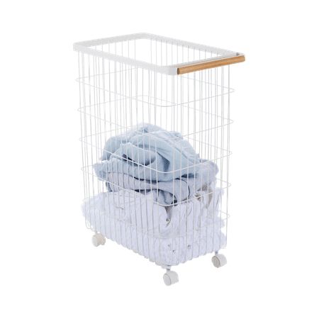 a white laundry basket with clothes in it