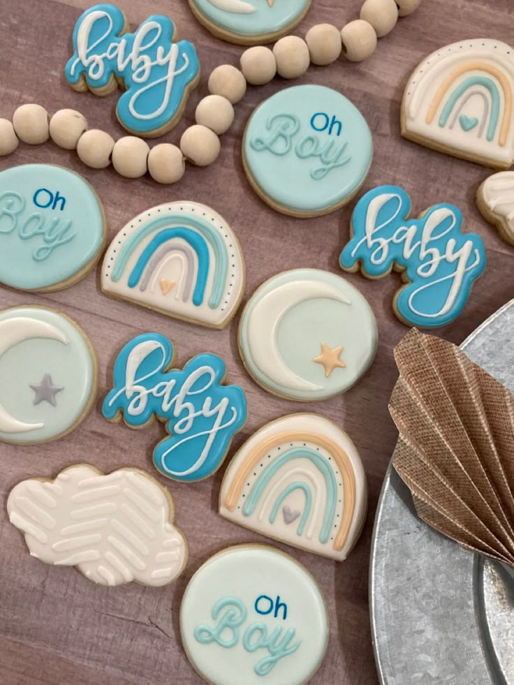 baby shower cookies are arranged on a table