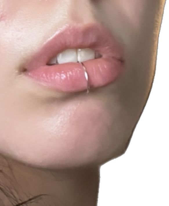 a close up of a woman's face with her nose open