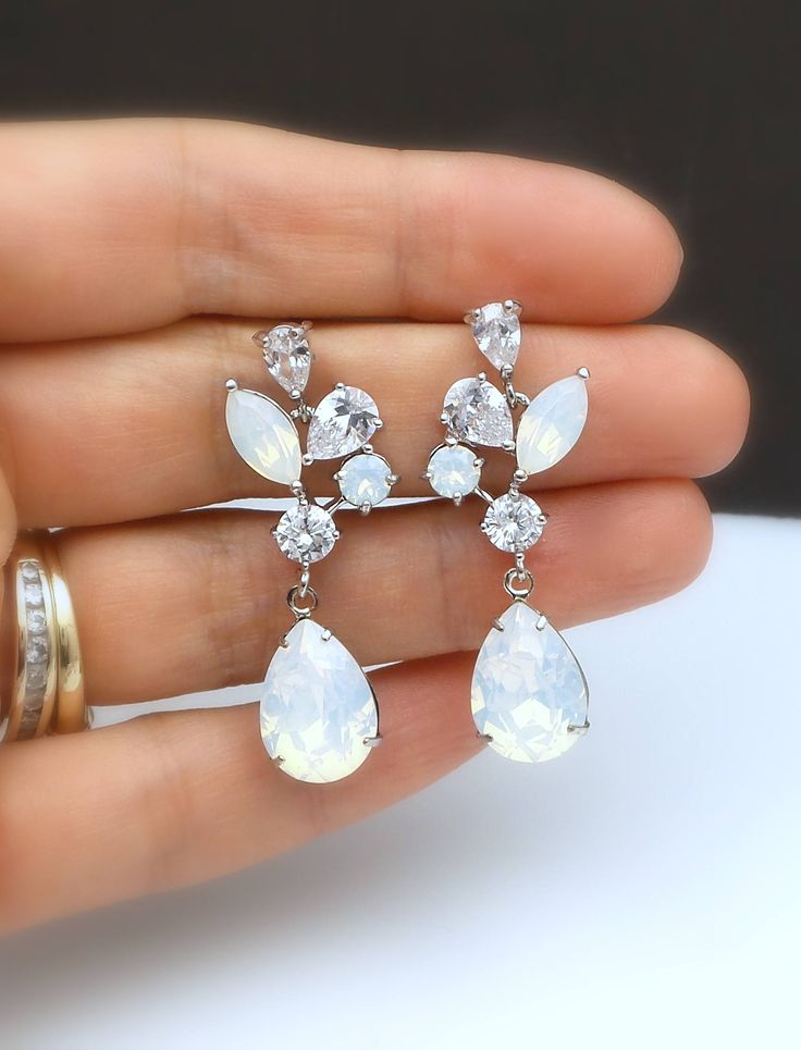 rhodium silver plated metal setting multi shapes clear white AAA quality cluster cubic zirconia post earrings with swarovski teardrop crystal rhinestone drop. sugical steel post. Total luxury Size: 4.1cm x 1.3cm Matching bracelet: https://www.etsy.com/listing/536766337/bridal-jewelry-bracelet-prom-wedding?ref=listings_manager_grid Bridal Jewelry Bracelets, Jewelry Bridal, Matching Bracelets, White Opal, Wedding Earrings, Crystal Rhinestone, Post Earrings, Bridal Party, San Jose