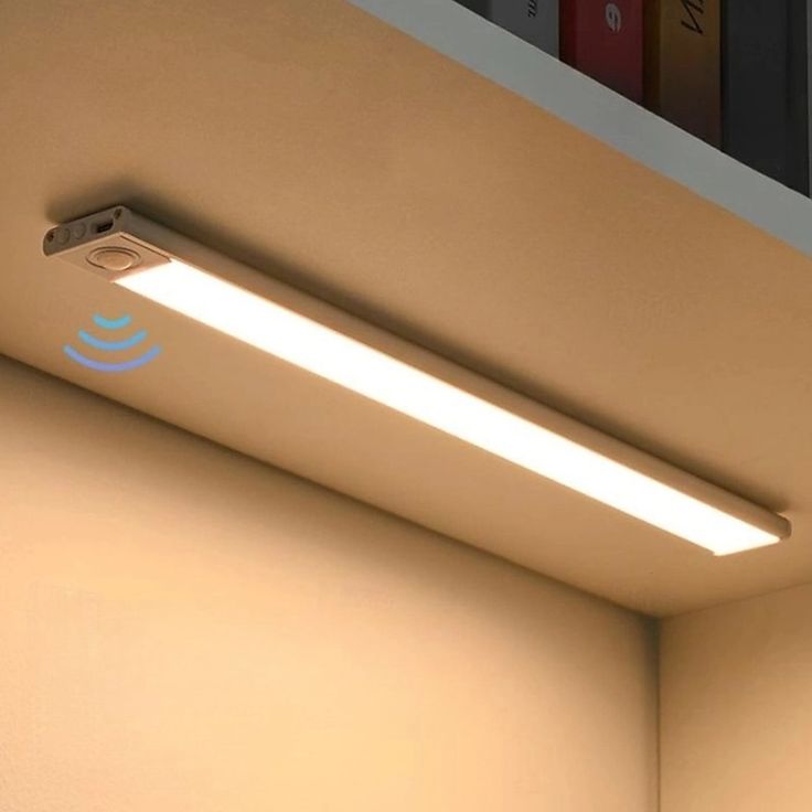 an image of a ceiling light in the corner of a room with bookshelves