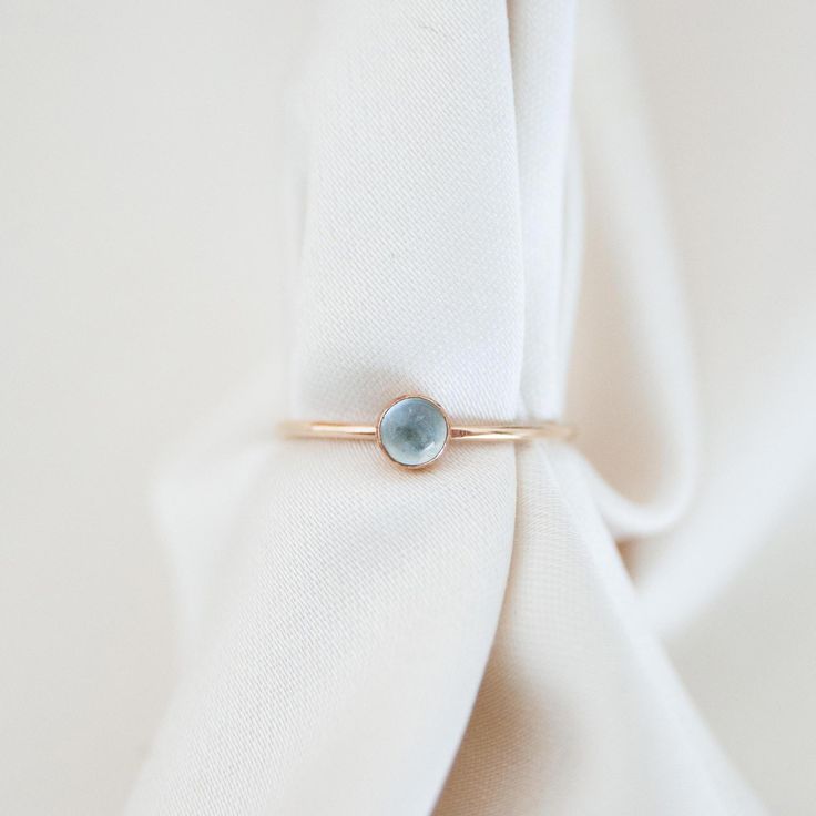 Everyone's favorite, aquamarine, shines in this ring. Its pale blue looks incredible in both silver and gold Details Band is 1 mm thick, stone is 4mm Gold fill or sterling silver Whole + Half sizes: US 3-14 (message us for smaller or larger sizes) See this page for ring sizing + conversions PS, check out our BFF, Soule Candles' aquamarine candles! Light Blue Aquamarine Birthstone Jewelry, Blue Birthstone Promise Ring Stackable, Blue Stackable Birthstone Ring For Promise, Blue Birthstone Ring In 14k Gold As Gift, Minimalist Aquamarine Gemstone Rings, Blue 14k Gold Birthstone Ring Gift, Blue May Birthstone Rings, Aquamarine Birthstone Ring In Fine Jewelry Style, Aquamarine Birthstone Crystal Ring In Fine Jewelry Style