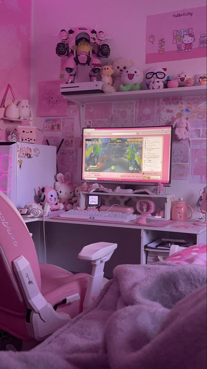 a room with pink walls and lots of stuffed animals on the wall, including a computer