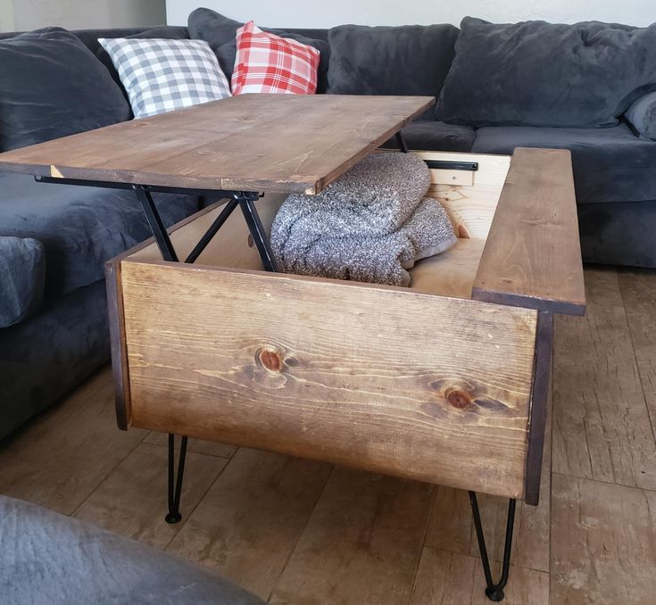 a living room with a couch, coffee table and two end tables in the middle