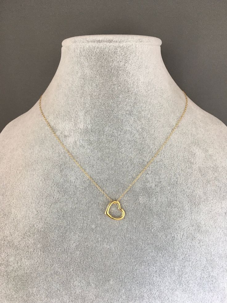 "A sweet and elegant floating 24k gold vermeil heart charm is simply suspended from a fine 14k gold filled chain. The chain measures 16\" with an extension to 18\" and is finished with a gold spring ring clasp. Please send a message if a different length chain is desired. A wonderful gift for a bride, best friend, or anniversary! Floating heart charm: 13x12mm Total length of charm: 1/4\" Gold chain: 1mm This necklace is also available in silver... www.etsy.com/listing/1076790169/silver-heart-nec Open And Close Heart Necklace, Everyday Gold Open Heart Jewelry, Delicate Gold Heart Pendant Charm Necklaces, Delicate Gold Charm Necklaces With Heart Pendant, Delicate Gold Charm Necklace With Heart Pendant, Gold Minimalist Heart Necklace With Round Pendant, Yellow Gold Heart Cut Charm Necklaces With Delicate Chain, Delicate Gold Heart Pendant Necklace, Gold Sterling Silver Open Heart Charm Necklace