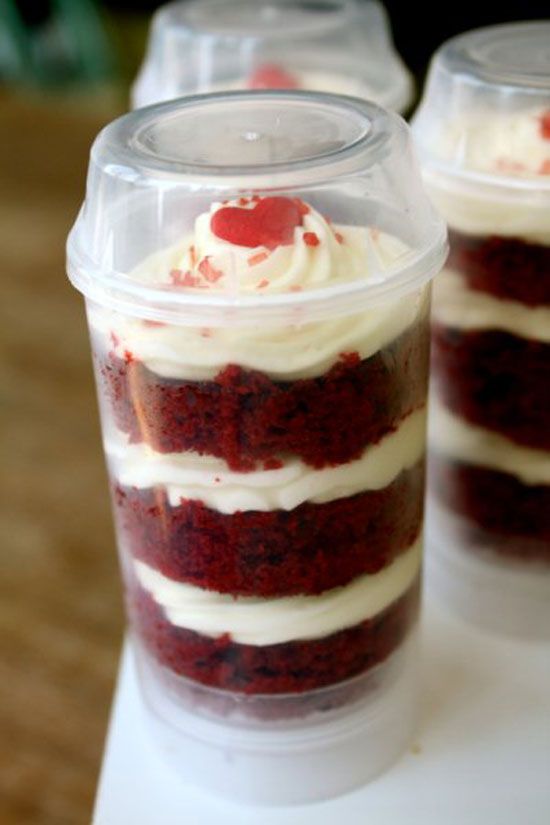 red velvet cake in a plastic cup with white frosting