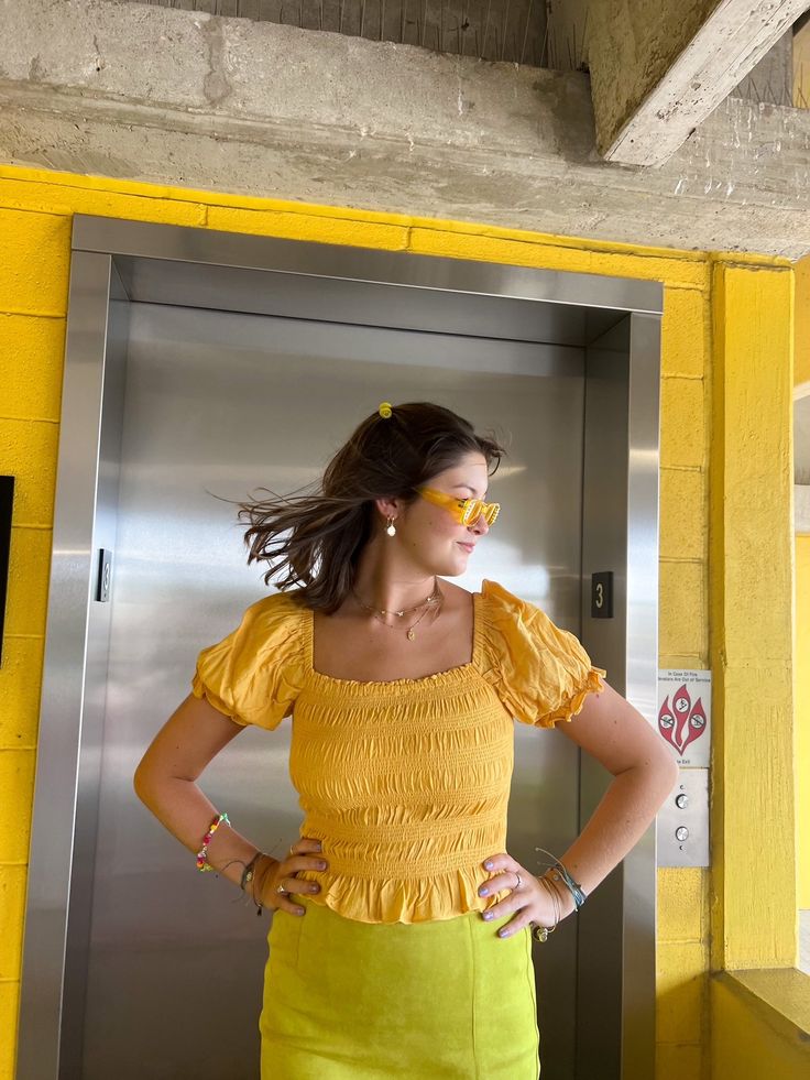 Puff sleeves straight from our dreams and a gorgeous soft yellow color to be obsessed with! This top has a stretchy fabric and stitching to fit just right. Puff sleeves can be worn on or off the shoulder. Seen paired with the Live Free skirt. True to size. 100% VISCOSE Puff sleeves- on or off shoulder! Style with denim, oranges, and greens! Kristin is 5’10 wearing a size Medium and she typically wears a medium. Seen styled with: Live Free Mini Skirt https://www.aspynandivy.com/products/live-free Solid Color Summer Puff Sleeve Top, Summer Solid Color Smocked Puff Sleeve Top, Summer Smocked Puff Sleeve Top, Solid Puff Sleeve Smocked Top For Summer, Solid Summer Smocked Top With Puff Sleeves, Puff Sleeve Smocked Top For Day Out, Trendy Fitted Smocked Top With Gathered Sleeves, Yellow Fitted Smocked Top, Fitted Yellow Smocked Top