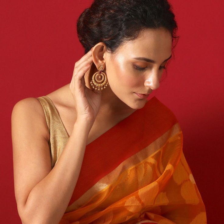 About the Jewelry Looking for earrings that give you a traditional look with a pinch of the modern Indian chic? Kalpa is what you need. Crafted beautifully with various patterns and texture these chaandbalis makes you look elegant in the best way possible. Styling Tip A semi-ethnic attire or a tunic will go perfectly with these earrings. Details & Specifications: Materials used: Brass Metal with Antique Plating Weight - Earrings 21 gm Length - Earrings 6 cm Make it custom Want to make it a custo Elegant Festive Hoop Earrings With Latkans, Fusion Style Drop Earrings For Festivals, Festive Fusion Style Hoop Earrings, Festive Fusion Hoop Earrings, Festive Drop Earrings Danglers, Gold Chandbalis With Cutdana Detail, Traditional Hoop Earrings With Latkans For Festive, Diwali Drop Earrings Danglers, Gift Danglers For Navratri