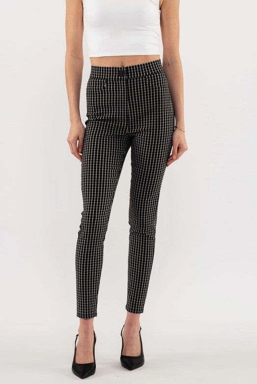 Add modern style to your wardrobe with these checkered-pattern skinny leg pants. Featuring decorative pockets, a snap button and a high waist, these are designed to be both comfortable and flattering. The black and white checkered print adds a urban styling, taking them from work to date night. Small is 28.5" inseam and 28.5" waist. Stretchy, but go up a size if you have bigger hips. Made in China 75% rayon; 22% polyester; 3% spandex Hand wash cold Trendy Gingham Bottoms For Workwear, Chic Plaid Bottoms For Business Casual, Trendy Fitted Gingham Bottoms, Trendy Gingham Bottoms, Trendy Gingham Fitted Bottoms, Fitted Trendy Gingham Bottoms, Black Houndstooth Trousers, Chic Fitted Houndstooth Pattern Bottoms, Chic Plaid Houndstooth Pants