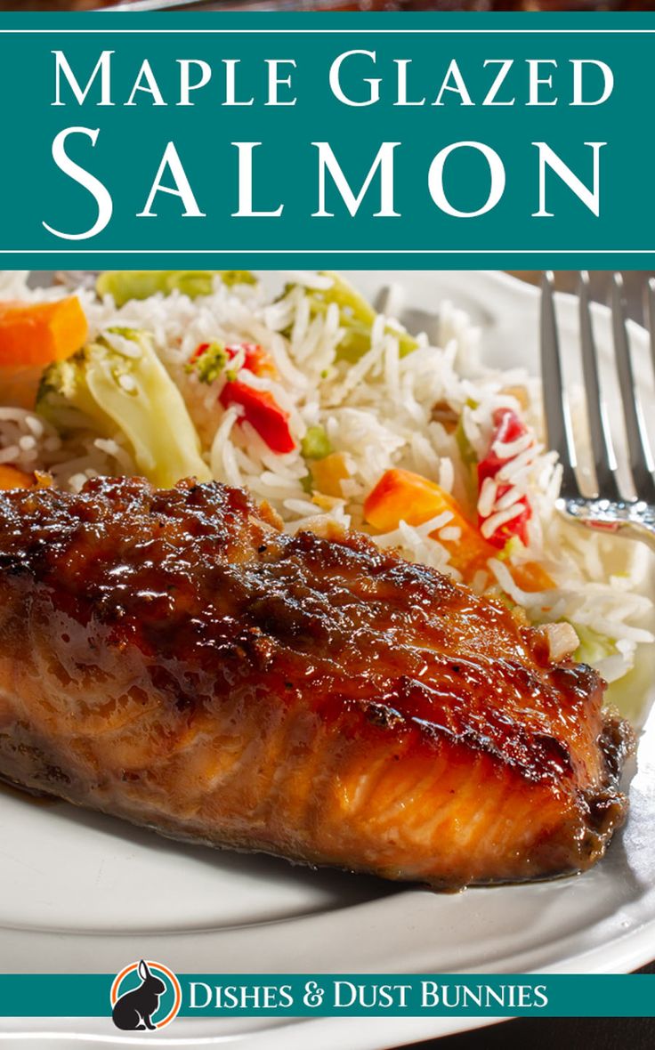 the cover of maple glazed salmon on a plate with coleslaw and carrots