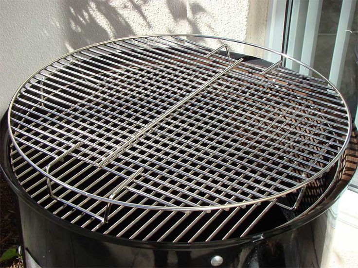 a large grill sitting next to a window