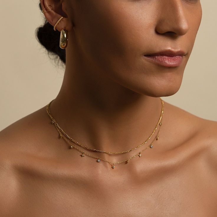 This elegant necklace from our signature O Collection, is made with the finest Italian Figaro chain. Pair it with other necklaces from this collection. Our patented connectors let you easily link and layer necklaces in any order you desire. Italian Figaro chain, width 2mm Adjustable chain: 17-19in (43-48cm) When layered, chain length is: 17-23in (43-58cm) Learn more Gold Vermeil Spring clasp closure Hypoallergenic, lead and nickel free #194G Layer Necklaces, Necklaces Unique, Figaro Necklace, Layered Choker Necklace, Figaro Chain Necklace, Silver Necklace Set, Layered Chain, Layered Necklace Set, Necklace Sets