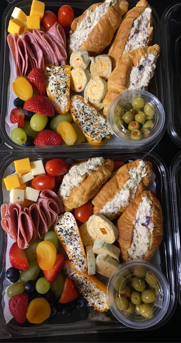 two plastic trays filled with different types of food on top of eachother