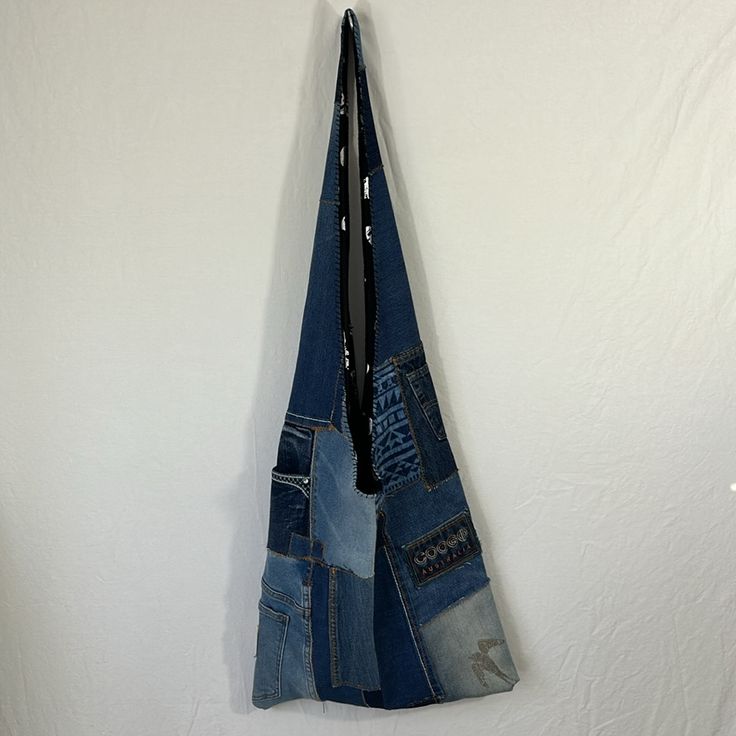 Made From Recycled Materials Measurements: Length 36” From Shoulder To Bottom Wide: 16” Lined Blue Tote Hobo Bag For Festivals, Blue Denim Hobo Shoulder Bag, Blue Tote Shoulder Bag For Festivals, Bohemian Blue Hobo Tote Bag, Casual Blue Upcycled Bags, Blue Patchwork Shoulder Bag For Travel, Blue Patchwork Travel Shoulder Bag, Blue Upcycled Shoulder Bag For Everyday Use, Everyday Blue Upcycled Shoulder Bag