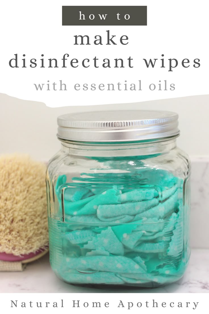 a jar filled with blue and green disinfectant wipes next to a brush