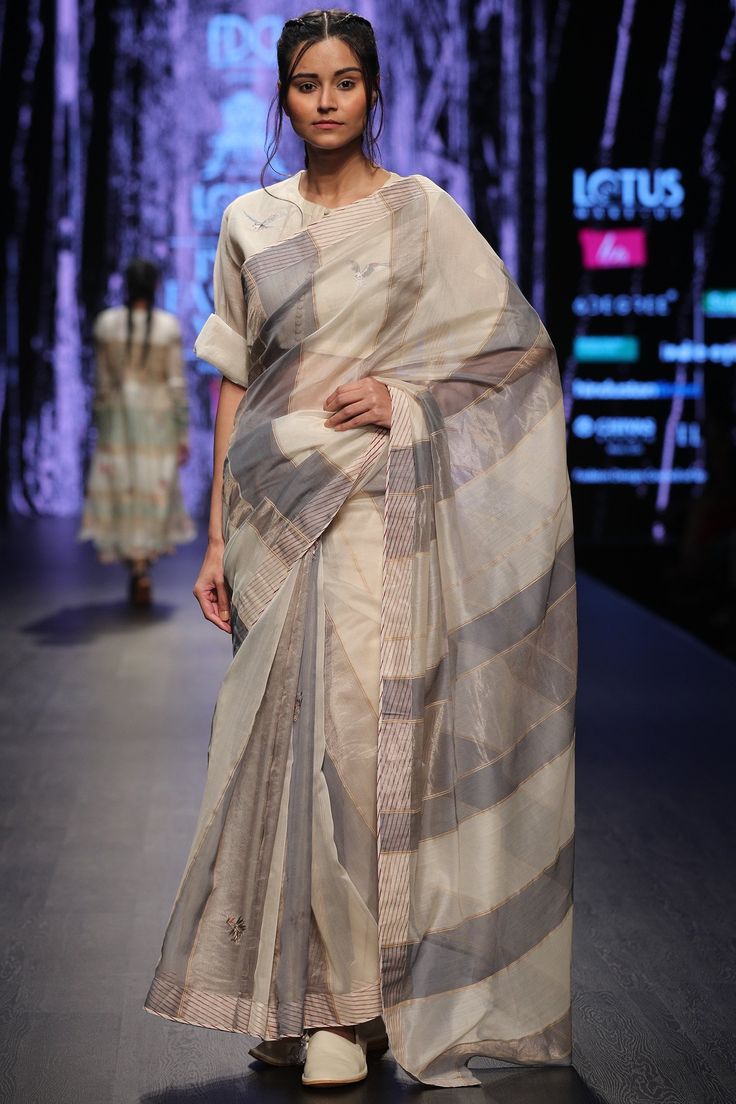 Grey saree with all-over stripes and zari woven detail.
Components: 1 
Neckline: NA
Sleeve Length: NA
Striped pattern
 Zari woven

 - Aza Fashions Pratima Pandey, Maheshwari Saree, Latest Designer Dresses, Grey Saree, Ivory Blouse, Latest Designer Sarees, Lehenga Style, Lehenga Collection, Lakme Fashion Week