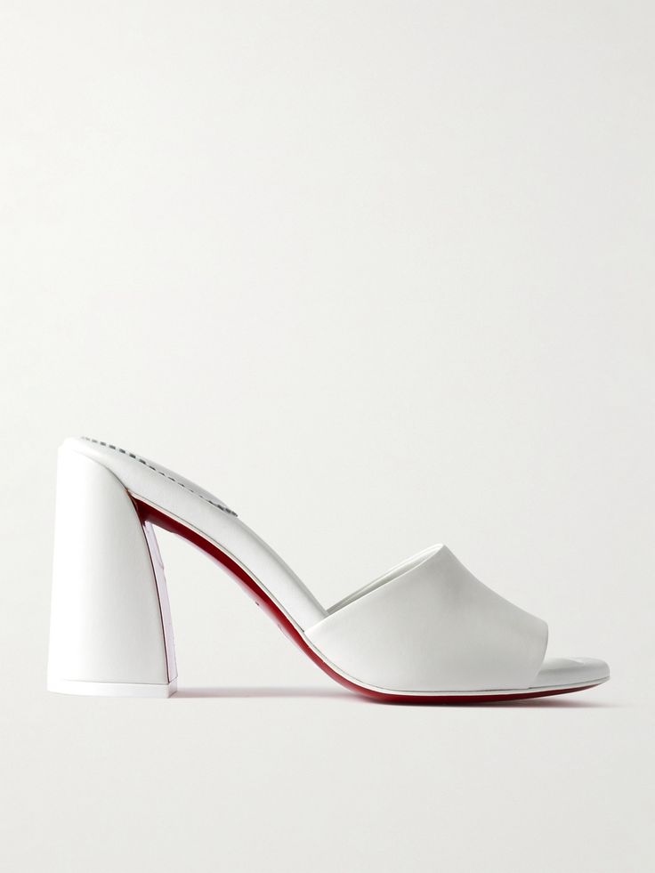 Christian Louboutin gives understated styles of the '90s a fresh update, resulting in these 'Jane' mules. Made from smooth leather, they have a wide strap and are set on a sculptural block heel that adds 85mm of lift. The sole is coated with the house's signature red lacquer. Christian Louboutin Mules, Designer White Leather Mules, Designer White Slip-on Mules, White Mules Heels, White Leather Slip-on Mules, Louboutin Shoes Clogs & Mules, Red Leather Coat, Build Wardrobe, Christian Louboutin Women