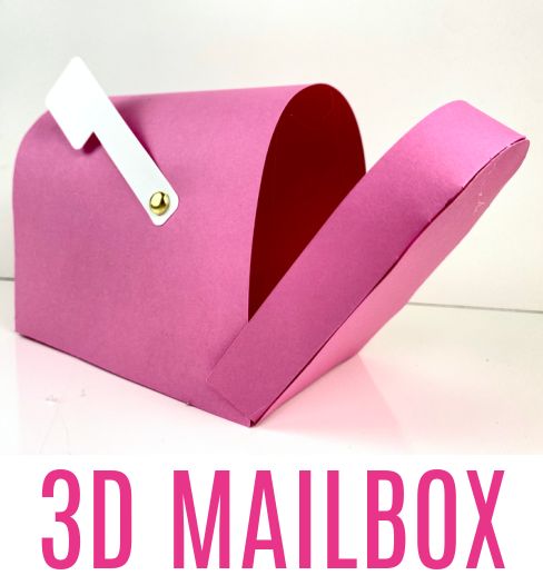 a pink paper mailbox with a heart shaped hole in the middle and a white tag attached to it