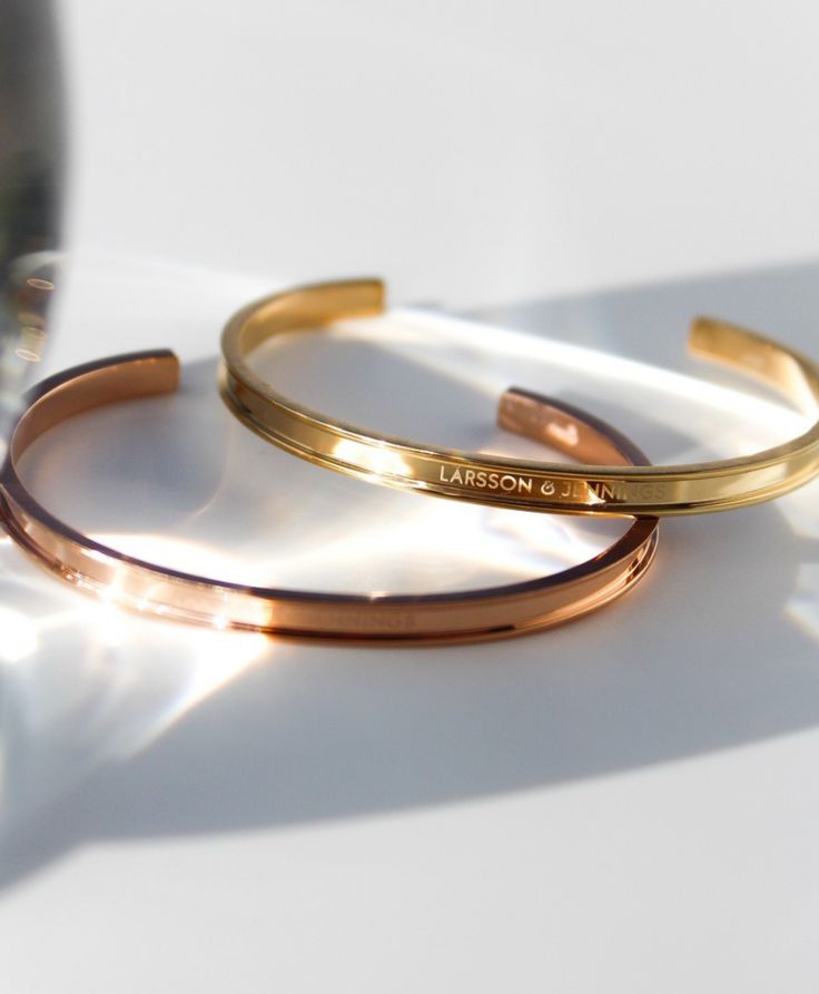 The perfect pairing for your Larsson & Jennings timepiece, introducing our Classic and Link bangle. Featuring subtle engraving, the bangle is an elegant choice whatever the occasion. Wear alone or mix the metals for a dynamic look. Available in Small or Large. Dimensions: SMALL Length: 2.3'' Width: 1.6'' LARGE Length: 2.7'' Width: 1.9'' Elegant Engraved Stainless Steel Cuff Bracelet, Timeless Rose Gold Stainless Steel Bracelets, Timeless Stainless Steel Bracelets For Anniversary, Adjustable Polished Rose Gold Bangle, Adjustable Rose Gold Bangle With Polished Finish, Classic Stainless Steel Bangle For Formal Occasions, Gold Cuff Bracelet With Engraving Option, Timeless Gold Engraved Bangle, Classic Adjustable Rose Gold Bangle