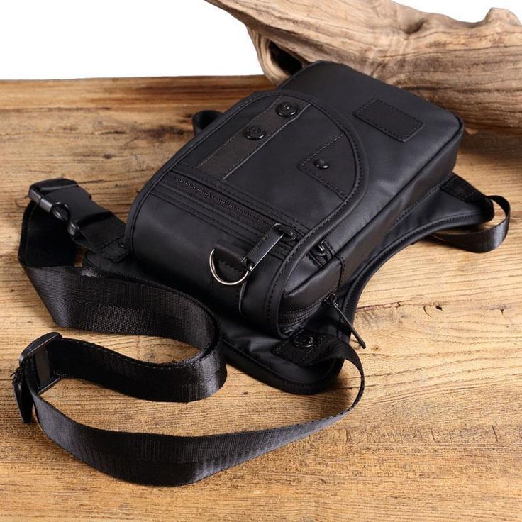 Do you end up with stuffed pockets when you don't really want to carry a rucksack or a bag? In that case, this Premium Biker Leg Bag is just what you need! It looks cool and will compliment your biker look. At the same time, it is roomy enough for all your essential items like wallets, cards, keys, smartphone, earbuds, etc. With this leg bag, you can relax and be sure that you have a secure, durable, and easy to carry accessory The Premium Biker Leg Bag is made from high-quality Oxford material Black Portable Chest Bag For School, Black Anti-theft Chest Bag, Black Anti-theft Shoulder Chest Bag, Portable Black Shoulder Bag For Outdoor Activities, Anti-theft Shoulder Chest Bag For Outdoor Activities, Multifunctional Anti-theft Chest Bag For Outdoor, Black Shoulder Chest Bag For Outdoor, Black Chest Shoulder Bag For Outdoor, Functional Chest Bag With Pockets For Everyday Carry