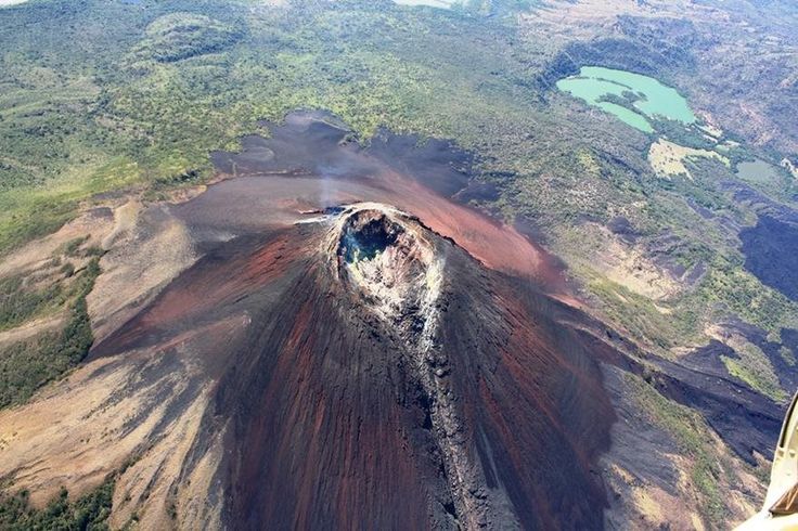 an aerial view of a volcano in the middle of nowhere