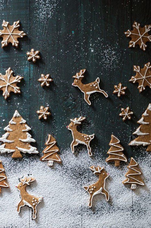 christmas cookies are arranged in the shape of trees and deers