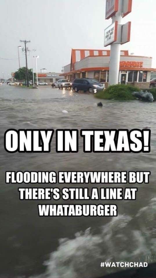 there is a sign that says only in texas flooding everywhere but there's still a line at whataburgr