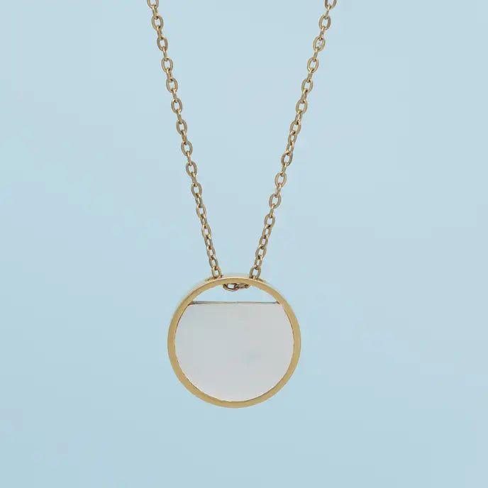 The Iris Mother-of-pearl necklace is simply beautiful. The stunning mother-of-pearl glistens and glows in shades of lavender, blue, green and blushing pinks as you pair it with your favorite top or dress. The adjustable, reversible design allows you to choose between the color-catching mother-of-pearl or the simplicity of shining 14k plated gold on a classic 14k gold-plated chain. Your purchase of the Iris Necklace, to gift or to keep, allows the women of Starfish Project the freedom to choose t Elegant Mother Of Pearl Shell Pendant Necklace, White Necklace With Delicate Chain, Elegant Pendant Shell Necklace, Elegant Clavicle Chain Shell Necklace As Gift, Elegant Shell Necklace With Clavicle Chain As Gift, Chic White Round Necklace, Circle-shaped Pearl Drop Jewelry Gift, Chic Round Necklace With Adjustable Fit, Pearl Drop Jewelry Gift In Circle Shape