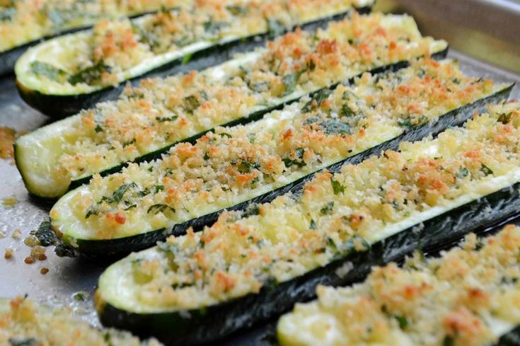 zucchini with parmesan cheese and seasoning on top