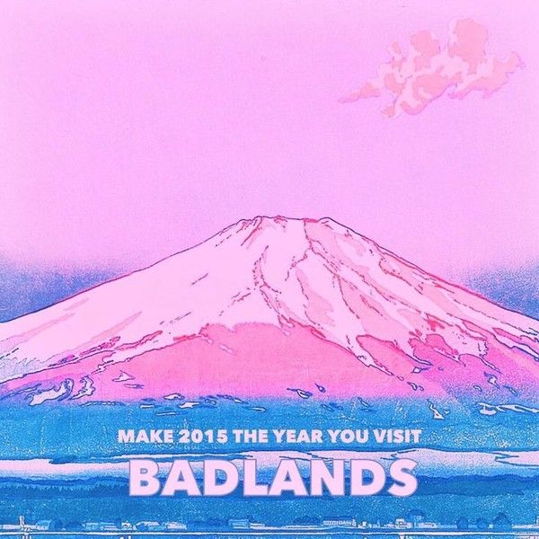 a pink poster with the words badlands in front of an image of a mountain