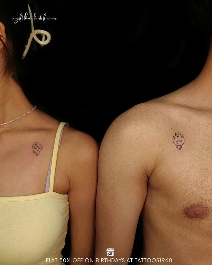 two people with small tattoos on their chests