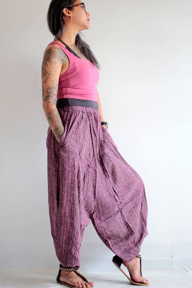 "Beautiful soft cotton fabric. Made into our popular dropcrotch capris pants but this one the crotch is not as low! 2 pieces of leg patch together in an untraditional way. We play around with the pattern and it turns out good! Simple elastic waist. cuff leg.2 super useful pocket on both sides. Very comfortable. Measurement; Waist (elastic) 24-26\" Hip max 36\" Length 33\"" Baggy Capri Pants With Pockets, Casual Harem Bottoms With Side Pockets, Baggy Harem Pants With Side Pockets, Summer Baggy Capri Length Pants, Spring Casual Drop Crotch Bottoms, Baggy Harem Pants With Tapered Leg And Hip Pockets, Baggy Harem Pants With Hip Pockets And Tapered Leg, Spring Capri Length Harem Pants With Pockets, Spring Capri-length Harem Pants With Pockets