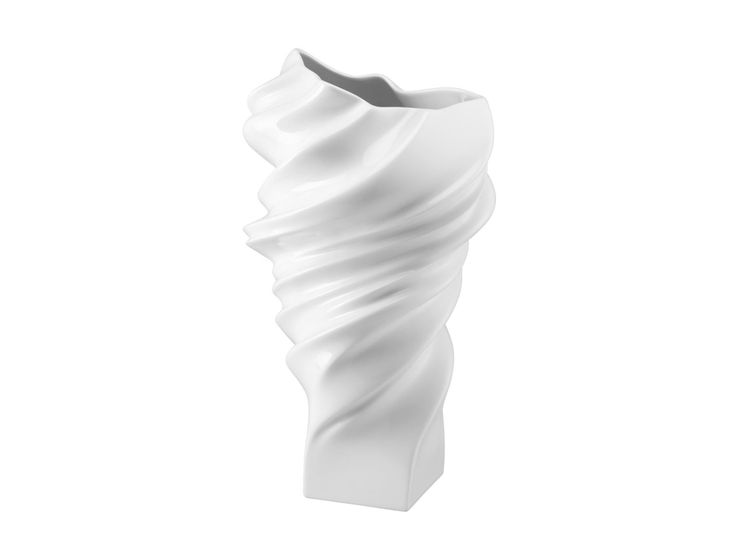 a white vase is shown on a white background and it looks like the shape of a wave