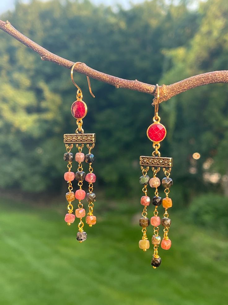 Mystic Tourmaline and Ruby Beaded Earrings – Willow West Jewelry Gold Bohemian Earrings With Gemstone Accents, Handmade Gold Tourmaline Earrings, Gold Dangle Beaded Earrings With Natural Stones, Gold Faceted Ruby Earrings, Gold Tourmaline Drop Earrings, Handmade Tourmaline Dangle Earrings, Gold Tourmaline Dangle Jewelry, Bohemian Gold Faceted Earrings, Cube Shape