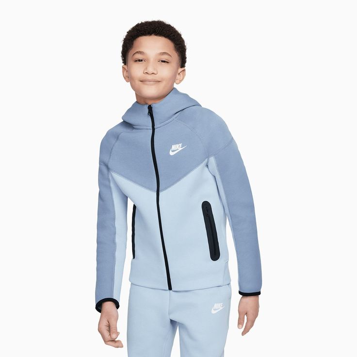 Nike Sportswear Tech FleeceBig Kids' (Boys') Full-Zip HoodieWhy should parents have all the fun? We've updated this collection to match your parents' Tech Fleece so you can rock what they wear (or what they wish they had). Our premium, lightweight fleece–smooth both inside and out–gives you plenty of warmth without adding bulk. Bonus: It comes in a bunch of colors, so you can match your parents or stand out on your own! Nike Sportswear Tech FleeceBig Kids' (Boys') PantsSay hello to Tech Fleece! Tech Fleece Boys, Nike Tech Blue Fleece, Nike Tech Fleece Baby Blue, Nike Tech Fleece Baby, Nike Tech Fleece Baby Boy, Nike Suit, Kids Sportswear, Boys Nike, Tech Fleece