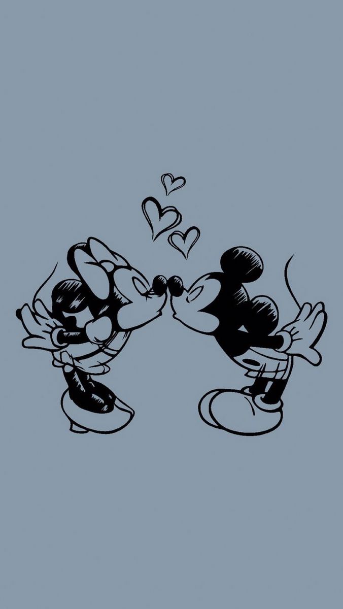 mickey and minnie kissing each other with hearts flying above them on a blue wallpaper background