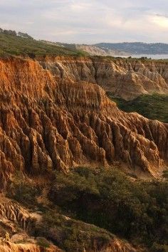 an area with many layers of rock and grass