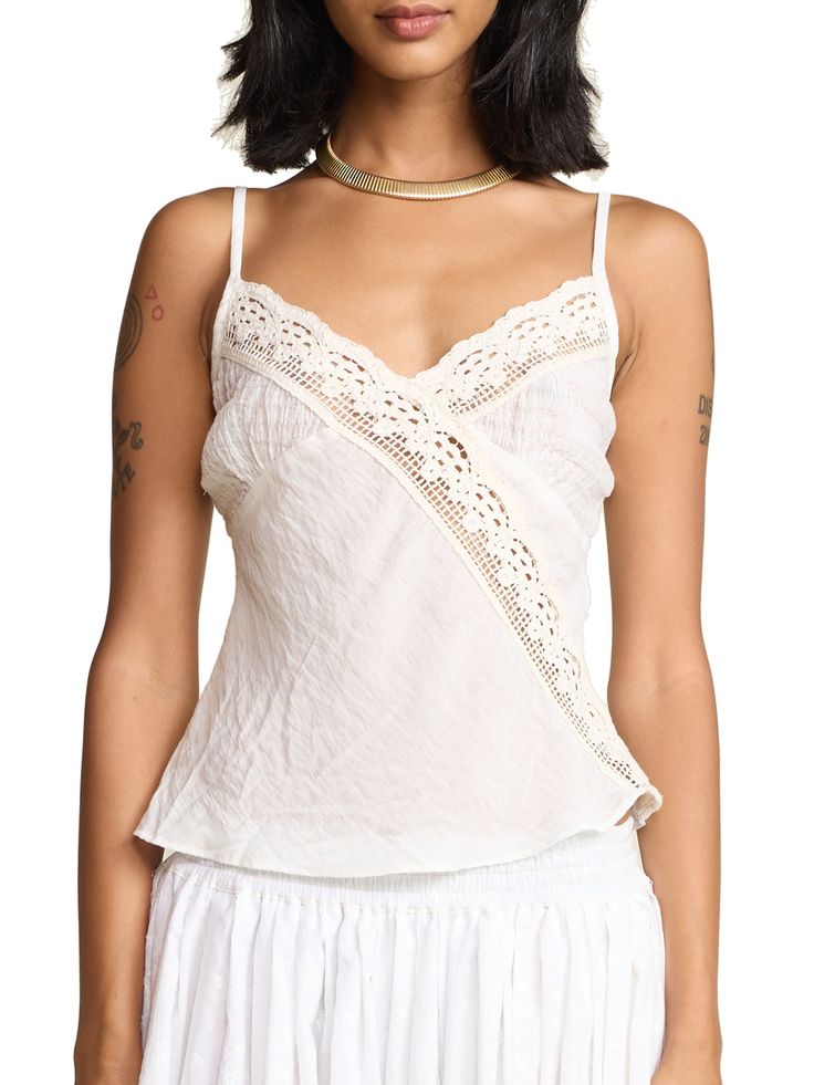 This classic cami effortlessly combines comfort and style, providing a soft and breathable fit for all-day wear. A fun summer twist on our classic Rio Camisole with sheer cotton gauze cups. 100% rayon body, 100% cotton lace and chest Made in Los Angeles Save Energy: cold water wash and air dry (or tumble dry low) Rishika is 5'9 and wears a X-Small Cotton Tops With Built-in Bra For Daywear, Cotton Camisole With Built-in Bra For Vacation, Cotton V-neck Camisole With Adjustable Straps, Summer Cotton V-neck Camisole, Summer Crochet Top With Built-in Bra, Summer Cotton Tops With Built-in Bra, Feminine Camisole With Built-in Bra For Vacation, Chic Cotton Camisole With Built-in Bra, Chic Summer Lace Top With Built-in Bra