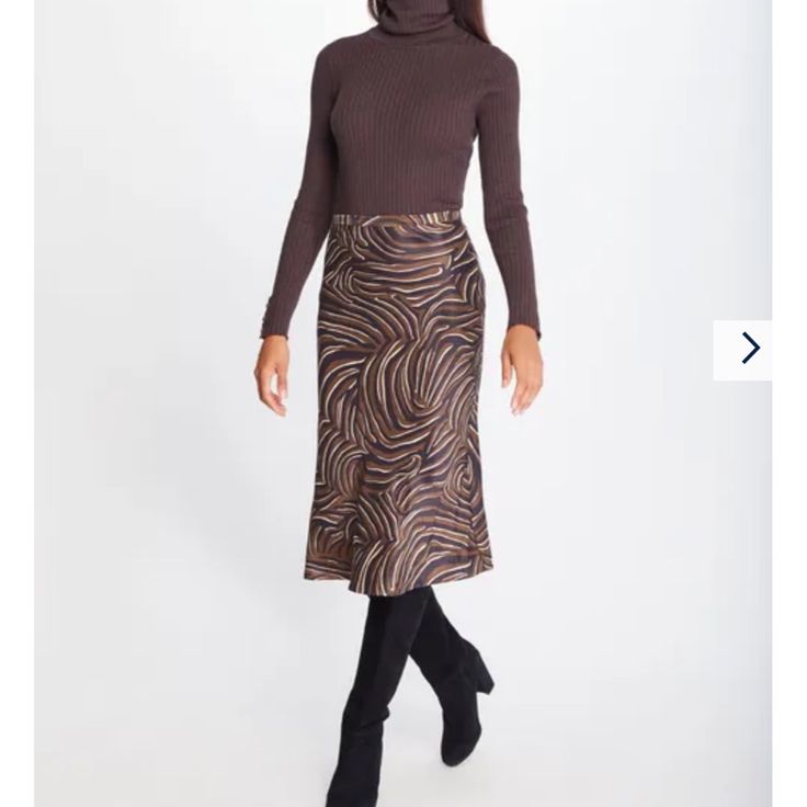 Cut On The Bias And Cast In A Silky Rayon Satin, Our Leopard Print Skirt Is Spring's It Piece. Zip Closure Bias Cut 100% Rayon Satin Dry Clean Only. Size & Fit 29" Long From Top Of Center Back (Size M) Model Is 5'9" And Wearing A Size Xs Brown Pleated Skirt For Night Out, Brown Lined Skirt For Fall, Brown Midi Skirt For A Night Out, Brown Midi Skirt For Night Out, Brown Party Bottoms With Flowy Fit, Brown Skirt For Fall, Fitted Brown Flared Skirt, Brown Fitted Flared Skirt, Brown Lined Skirt For Winter