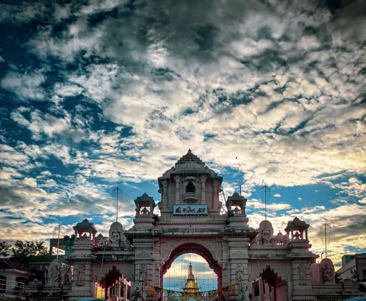 the entrance to an amusement park at dusk