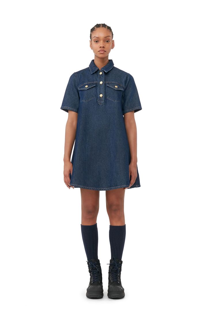 This Heavy Denim Mini Dress is made from organic cotton. The dress is designed for a relaxed fit and features a collar, button closure, front pockets and short sleeves. Denim Dress Outfit, Ganni Dress, Iconic Dresses, Dark Blue Denim, Denim Mini Dress, Womens Robes, Size 16 Dresses, Denim Mini, Mini Fashion