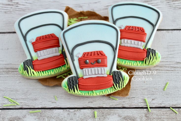 decorated cookies in the shape of lawn mowers