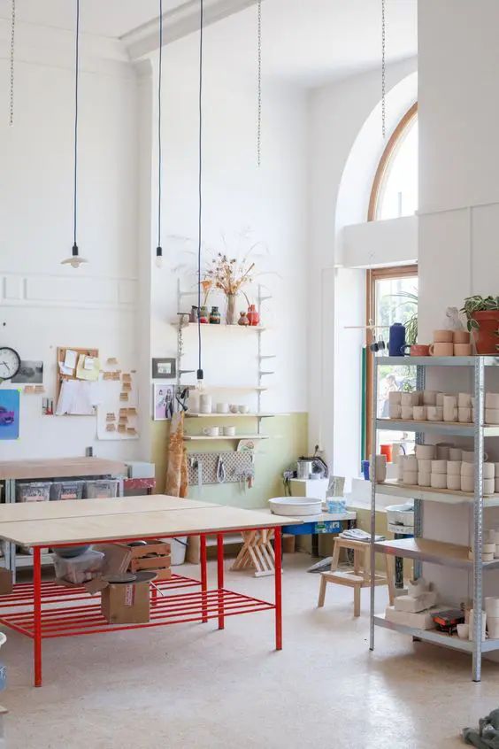 a room filled with lots of furniture and shelves