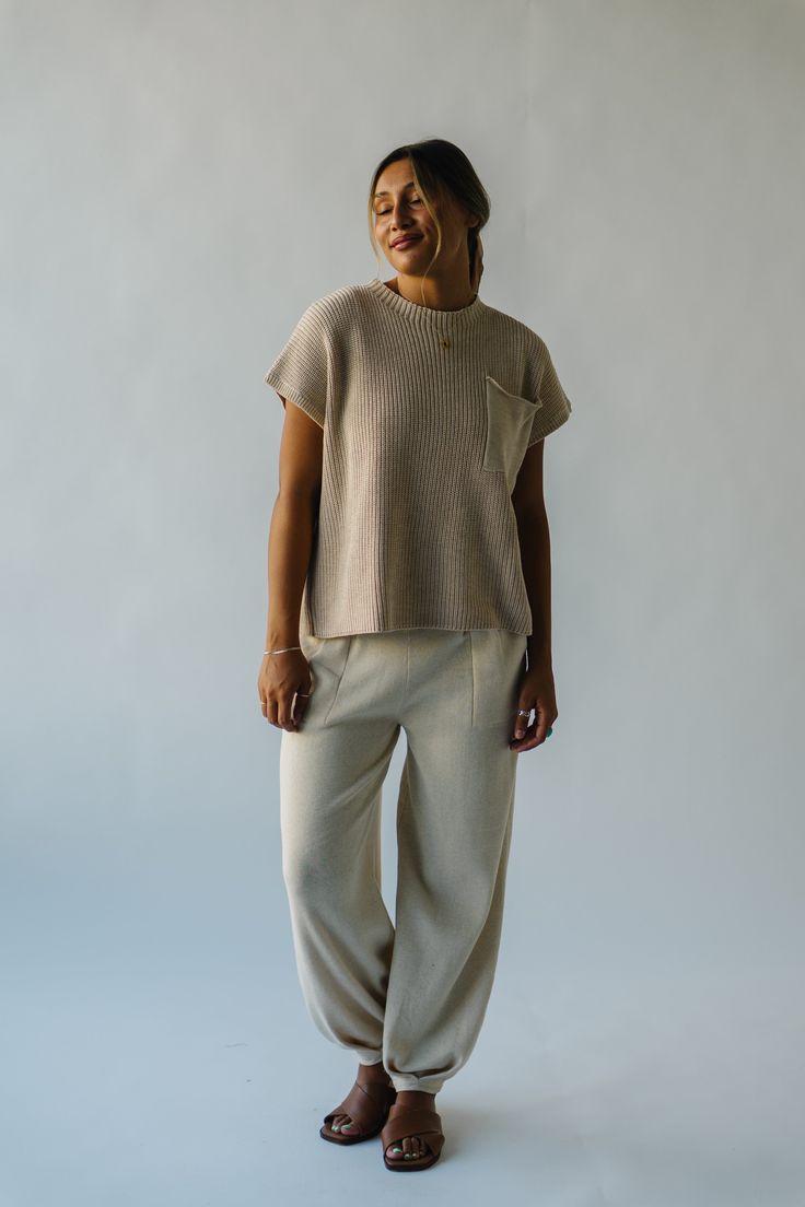 Introducing the playful and stylish Spackman Sweater Pant! Made with a cozy ivory fabric, this pant is perfect for lounging or running errands. Its unique design combines the comfort of a sweater with the convenience of pants. Stay cozy and stylish with this must-have addition to your wardrobe! (Takes loungewear to a whole new level!) Details self/lining: 85% polyester + 15% linen Fabric Care Guide Here Sizing & Fit Measurements are approximate and taken while laying flat across the front. Not doubled. small: waist = 12.5"; length = 37"; inseam = 26" medium: waist = 14"; length = 37.5"; inseam = 26.5" large: waist = 15.5"; length = 38"; inseam = 27" x-large: waist = 17"; length = 38"; inseam = 27" Try-on Video Relaxed Fit Beige Sweatpants With Pockets, Cozy Cotton Pants, Beige Relaxed Fit Sweatpants With Pockets, Cozy Relaxed Fit Pants For Loungewear, Cozy Relaxed Fit Loungewear Pants, Casual Winter Pants For Relaxation, Cozy Relaxed Fit Lounge Pants, Casual Knit Bottoms With Pockets, Winter Beige Relaxed Fit Sweatpants