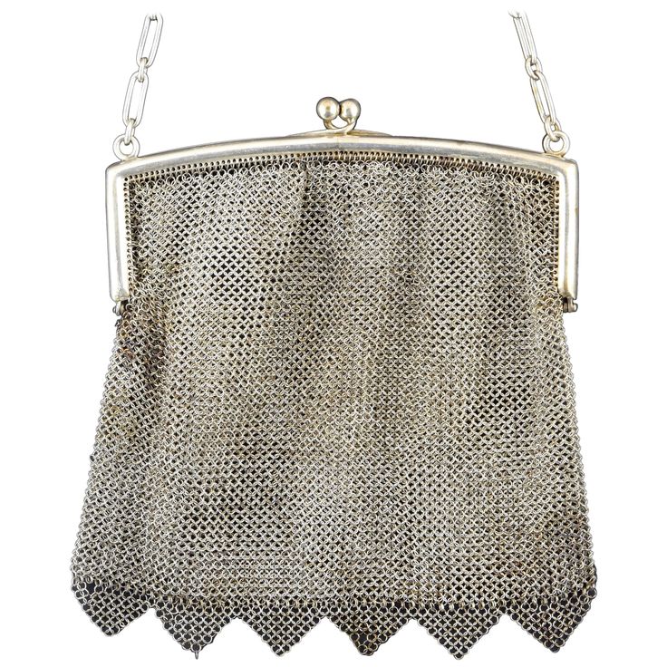 Silver mesh bag in its color decorated with triangular elements on the bottom that has a smooth closure by hinges and a chain of alternating long and short links. This type of pieces were very frequent in the 19th century, as a luxury element and a practical piece for galas and other special events. Weight: 187 gr" Size: 15 x 15 cms. Depth is orientative. Elegant Silver Bag With Chainmail Detail, Elegant Silver Chainmail Bag, Elegant Chainmail Bag, Elegant Evening Shoulder Bag With Chainmail, Rectangular Chainmail Evening Bag, Rectangular Evening Bag With Chainmail, Evening Rectangular Chainmail Bag, Silver Snake Bracelet, Serpent Jewelry